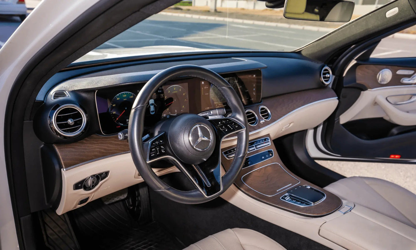 Rent Mercedes-Benz E350 AMG 2023 White or similar DRD Car Rental LLC