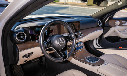Rent Mercedes-Benz E350 AMG 2023 White or similar DRD Car Rental LLC